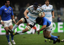 Pumas lock Manuel Carizza is tackled by Italy's Craig Gower