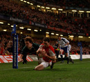 Wales wing George North dives over in the corner