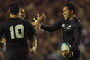 Mils Muliaina celebrates his try with Dan Carter