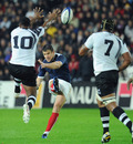 France fly-half Damien Traille boots the ball forward