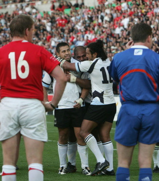 Fiji's Graham Dewes is congratulated by team-mates after his match-winning try, Wales v Fiji, World Cup 2007, Stade de la Beaujoire, Nantes, France, September 29, 2007