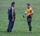 Australia centre Matt Giteau talks to coach Robbie Deans