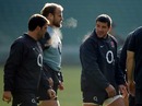 England flanker Hendre Fourie talks to team-mates Dan Cole and Mark Cueto