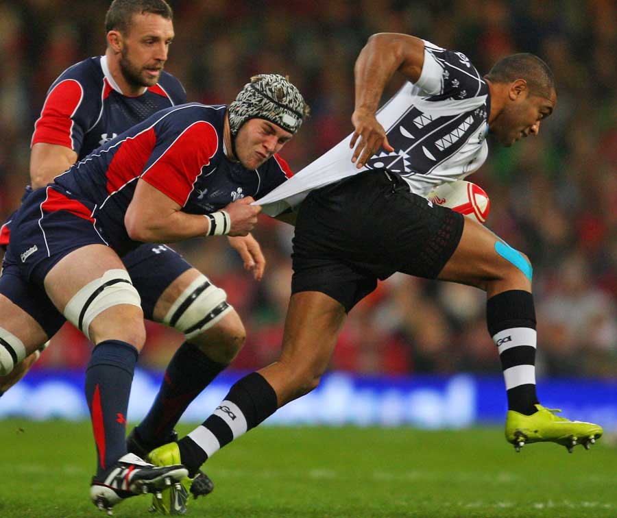 Fiji's Michael Tagicakibau is tackled by Wales' Dan Lydiate