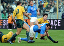 Italy's Gonzalo Canale is taken to ground by Drew Mitchell