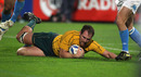 Wallabies skipper Rocky Elsom slides over for a late try