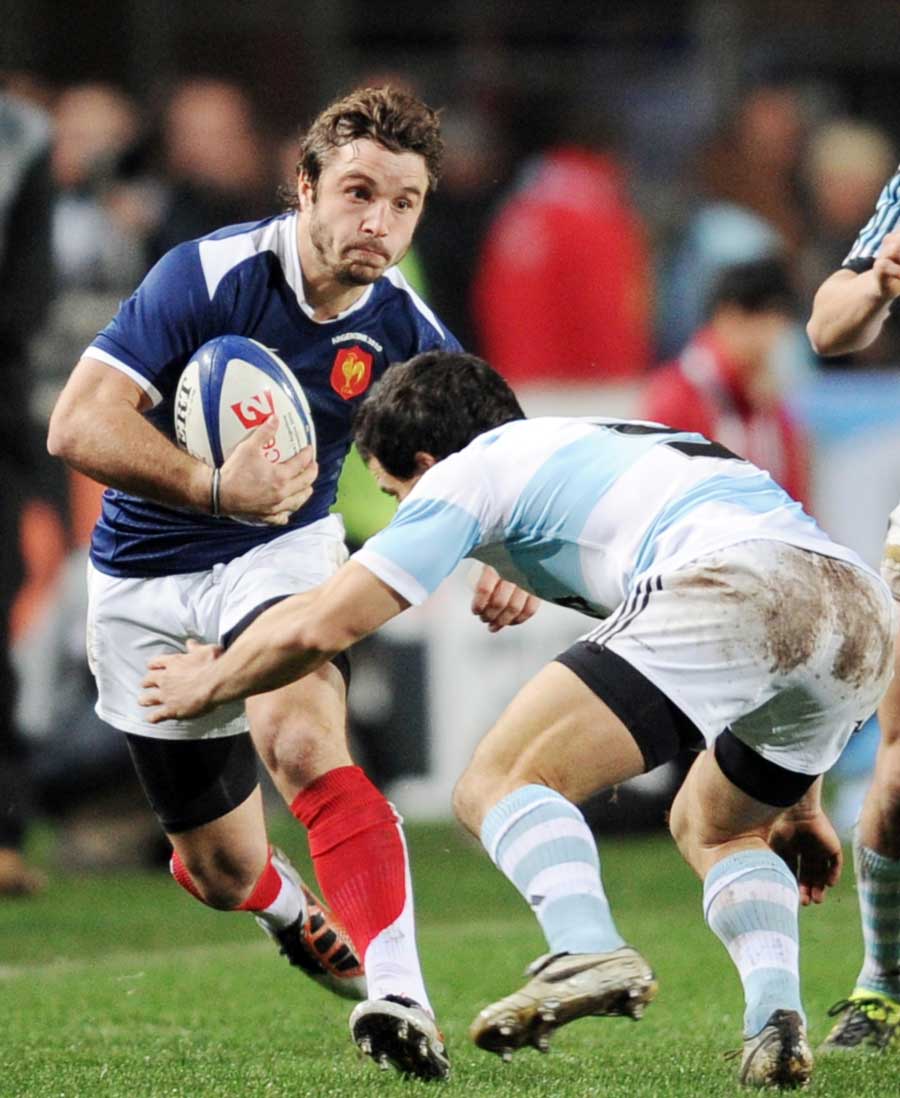 France wing Marc Andreu looks to break a tackle