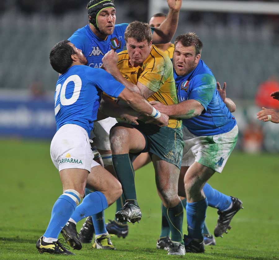 Australia's James Slipper attracts the attention of the Italy defence