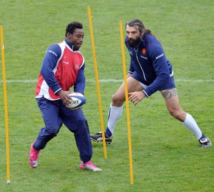 France flanker Fulgence Ouedraogo runs a drill with Sebastien Chabal during training, Marcoussis, France, November 23, 2010