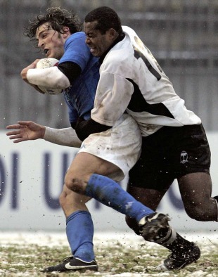 Italy's Mirco Bergamasco is tackled by Fiji fly-half Seremaia Bai, Italy v Fiji, Stadio Brianteo, Monza, Italy, November 26, 2005