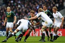 Juan Smith carries the ball into Tom Croft and Courtney Lawes