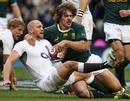 Mike Tindall and Frans Steyn battle for the ball