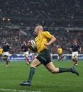 Drew Mitchell rounds off a try for Australia