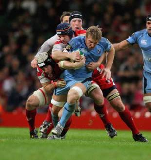 Andy Powell of Cardiff is tackled by Peter Buxton and Alasdair Strokosch (L) during the Heineken Cup match between Cardiff Blues and Gloucester at the Millennium Stadium in Cardiff, Wales on October 19, 2008.