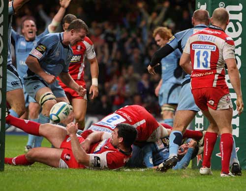 Nicky Robinson of Cardiff celebrates after scoring a try 