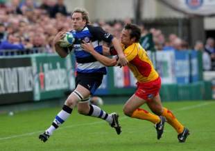 Bath player Butch James is tackled by Phillip Dollman of the Dragons during the Round Two  Heineken Cup Match between Bath and Newport Gwent Dragons at The Recreation Ground in Bath, England on October 19, 2008. 