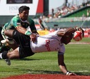 Fiji's Jerry Burotu stretches out to scores a try