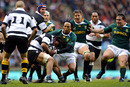 Barbarians flanker Rodney So'oialo is tackled by Odwa Ndungane