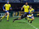 Clermont's Morgan Parra is wrapped up by Byron Kelleher