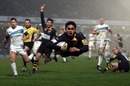 David Lemi dives over the try line in triumph