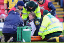 Harlequins centre Ollie Smith is stretchered from the field