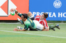 South Africa's Pieter Engelbrecht plants the ball over the Portuguese try-line