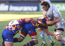 Leicester's Craig Newby is confronted by two tacklers