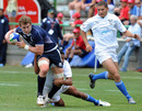 Struan Dewar of Scotland is tackled by Stein Gregory of Namibia