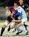 Saracens' Kelly Brown stretches the Racing Metro defence