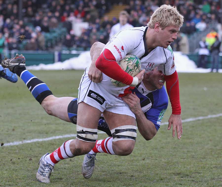 Ulster's Chris Henry is tackled by Bath's Butch James