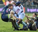 Bourgoin's Arnauld Tchougong is shackled by the Stade Francais defence