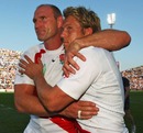 England's Lawrence Dallaglio embraces team-mate Jonny Wilkinson