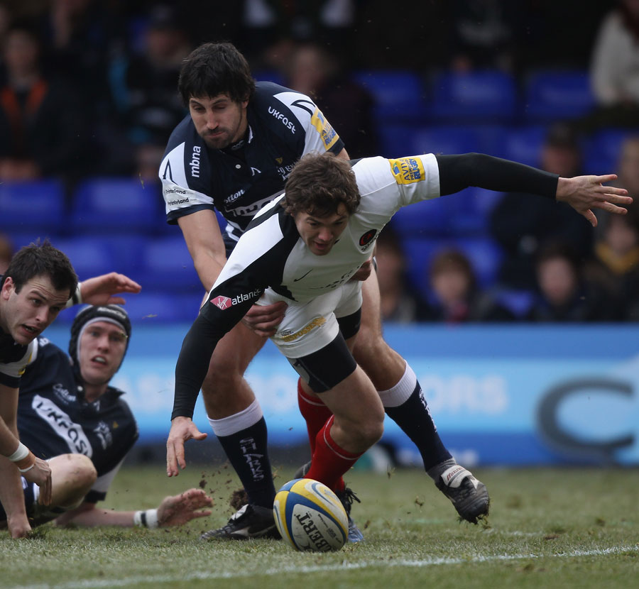 Saracens fullback Alex Goode attempts to gather a loose ball