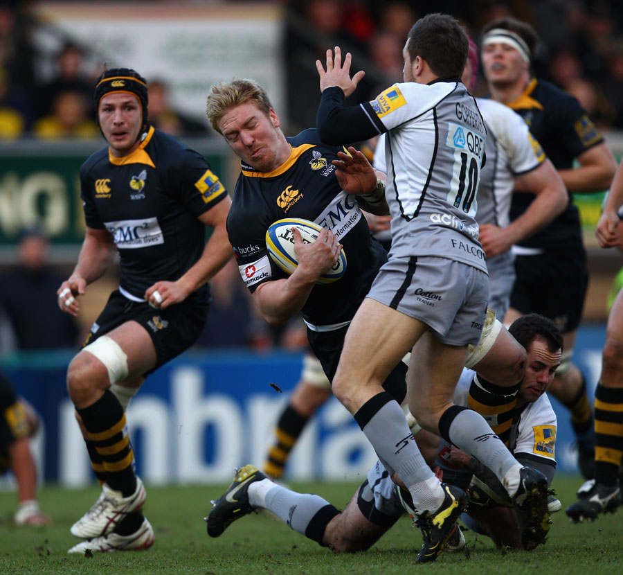 London Wasps No.8 Andy Powell is tackled to the floor