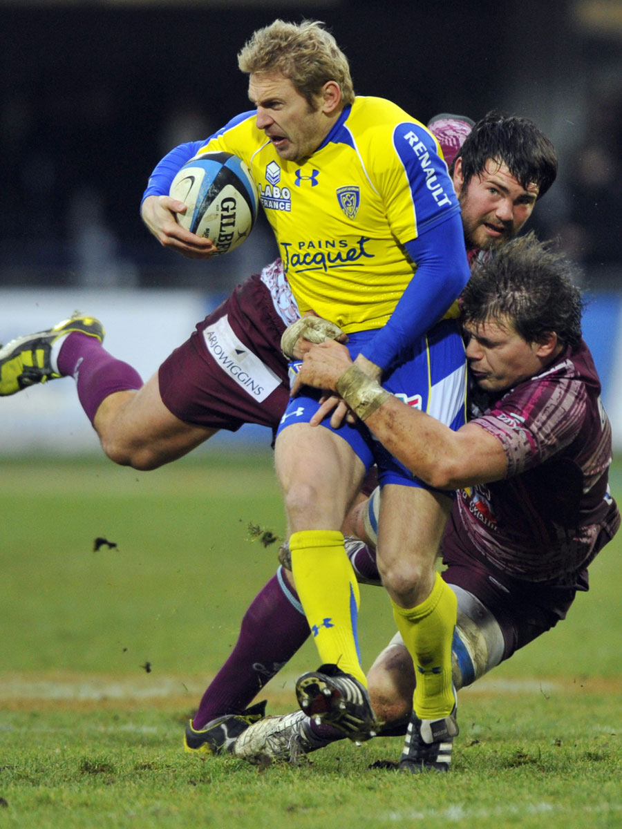 Clermont winger Brent Russell is dragged down against Bourgoin