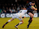 Bath fullback Jack Cuthbert is tackled by Leigh Hinton
