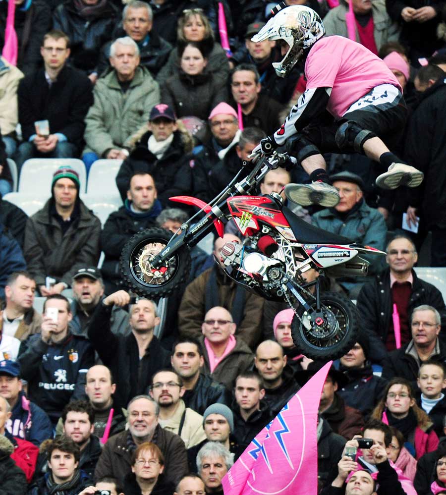 Motorcyclists entertain the Stade de France crowd