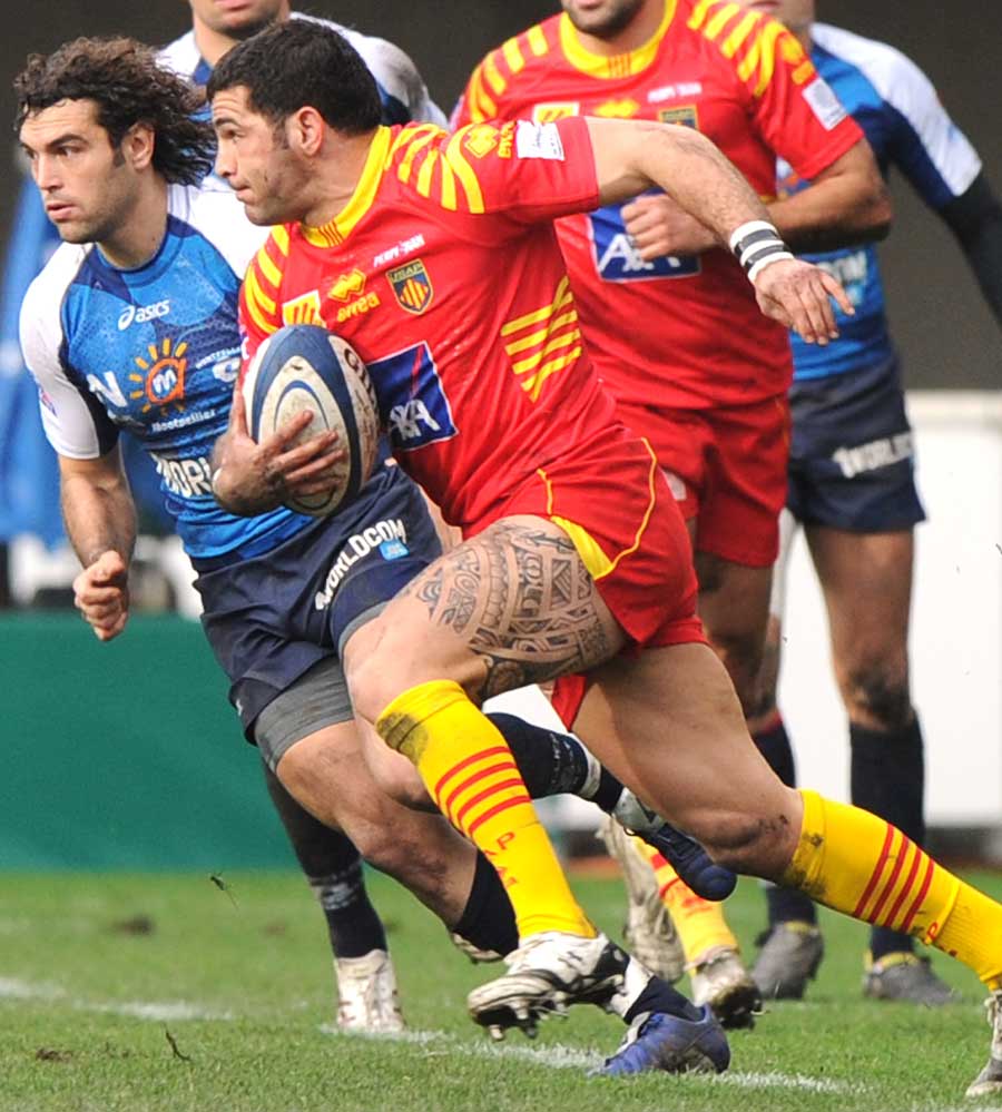 Perpignan's Farid Sid takes the ball to the Montpellier defence