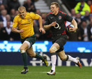 England's Chris Ashton accelerates away from Australia's Drew Mitchell