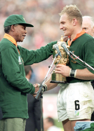 South Africa President Nelson Mandela presents the World Cup to Springboks skipper Francois Pienaar, South Africa v New Zealand, Rugby World Cup Final, Ellis Park, Johannesburg, South Africa, June 24, 1995