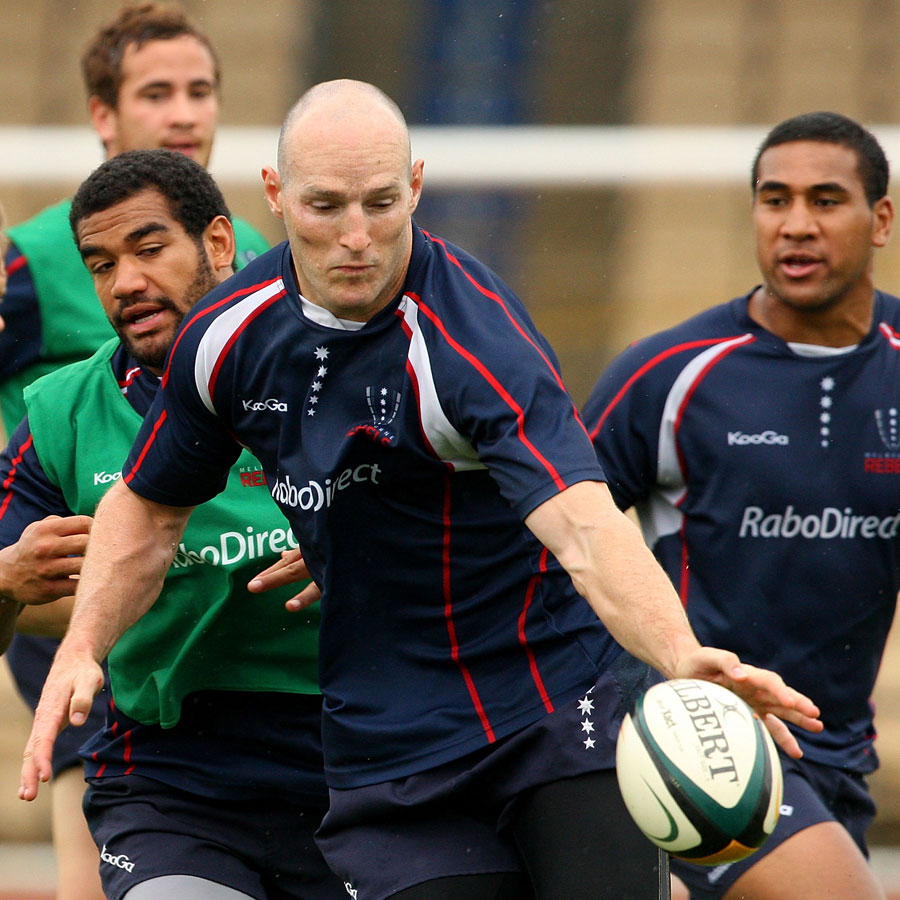 Melbourne Rebels centre Stirling Mortlock attempts to control the ball