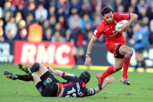 Toulouse's Clement Poitrenaud skips away from the Dragons defender, Toulouse v Newport Gwent Dragons, Heineken Cup, Stade Ernest Wallon, Toulouse, France, January 15, 2011