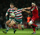 Leicester scrum-half Ben Youngs breaks Josh Turnbull's tackle
