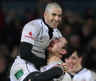 Ulster's Ian Humphreys and Paddy Wallace celebrate victory over Biarritz