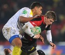Saracens' David Strettle is shackled by the Clermont Auvergne defence
