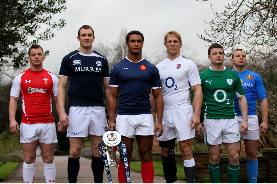 France flanker Thierry Dusautoir poses with the Six Nations trophy and his fellow captains