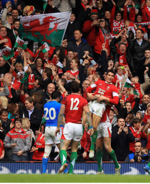 Try scorer James Hook is held aloft by his celebrating team mates as Wales beat Italy at the Millenium Stadium, Cardiff, Wales, March 20, 2010