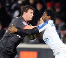Louis Picamoles of Toulouse goes head to head with Fulgence Ouedraogo of Montpellier