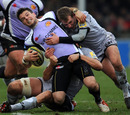 Exeter's Mark Foster is brought down by the Tigers defence