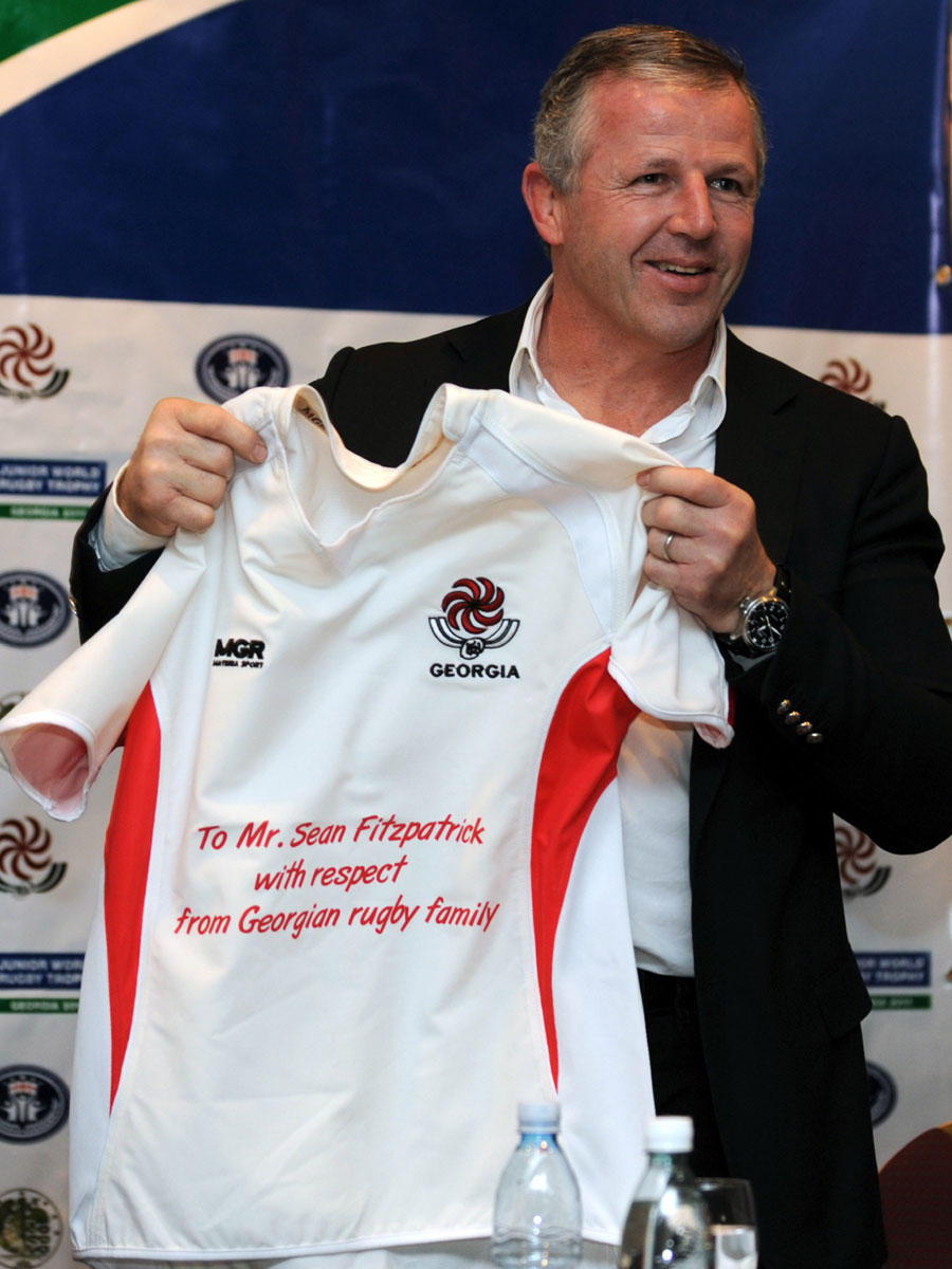 Sean Fitzpatrick holds up a shirt agreeing to an advisory role with Georgia, Tbilisi, Georgia, January 29, 2011